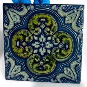 vintage La Campanella terracotta tile from Sassuolo, Italy hand-painted motifs.